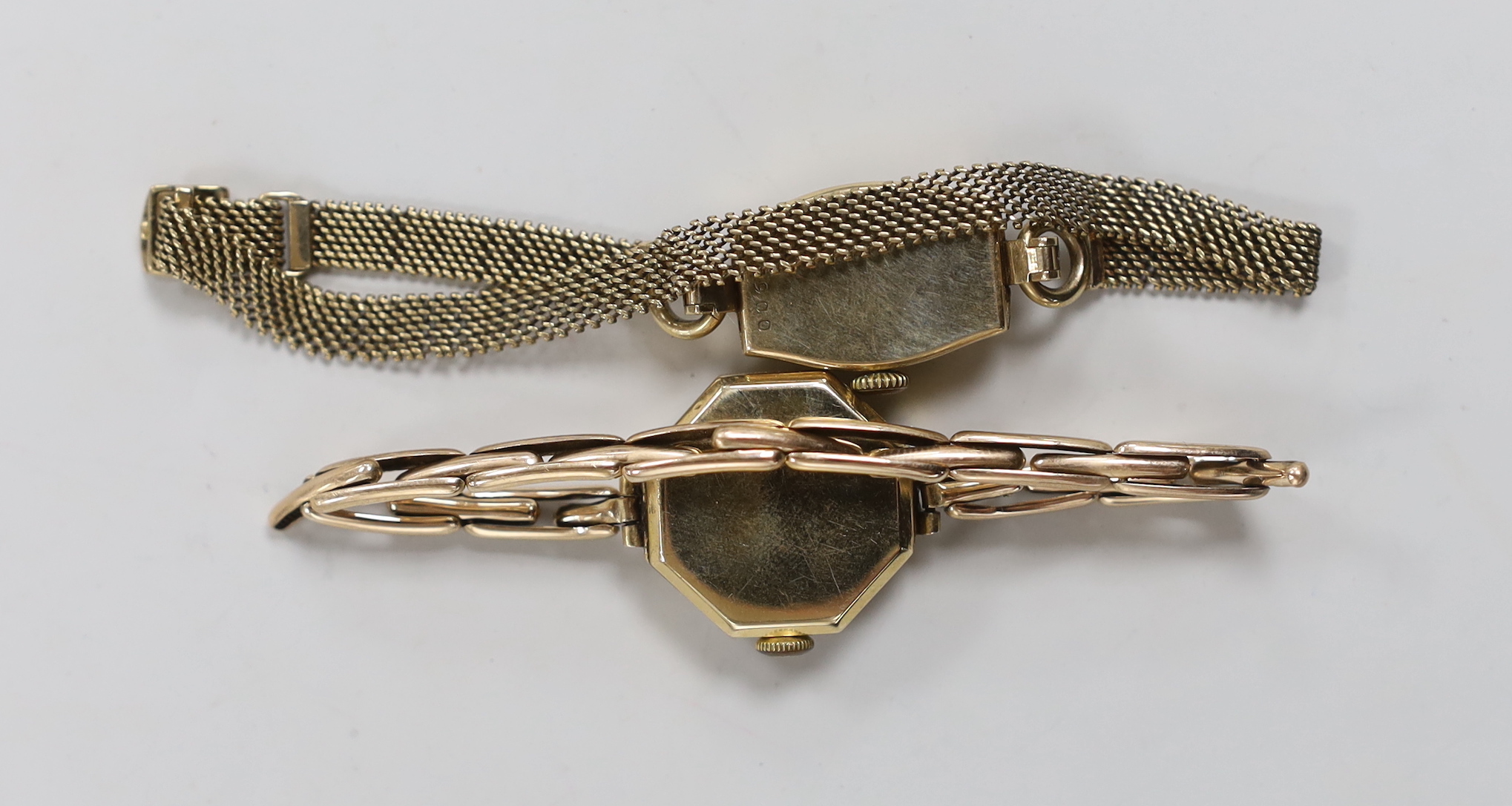 Two lady's 9ct manual wind wrist watches, one with 9ct gold bracelet, the other retailed by Mappin on an expanding yellow metal bracelet.